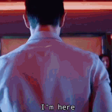 a man 's back is shown with the words i 'm here on the bottom