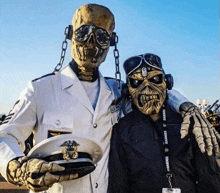 a skeleton in a military uniform poses with a man in a raiders lanyard