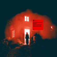 a person standing in front of a house with a red smoke coming out of the door
