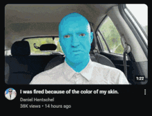 a man in a car with blue paint on his face