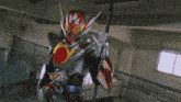 a man in a superhero costume is standing in a room