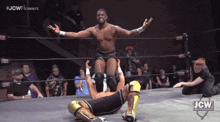 a man in a wrestling ring with the jcw logo on the bottom