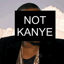 a picture of a man with a sign that says not kanye