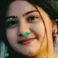 a close up of a woman 's face with green squares on her nose