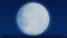 a full moon in the night sky with a person flying in the background