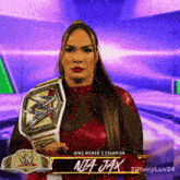 a woman holding a wwe women 's championship belt