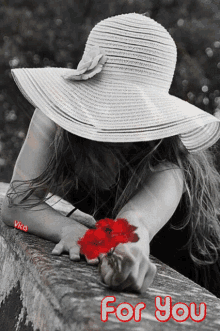 a black and white photo of a woman holding a red flower with the words for you written on the bottom