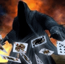 a grim reaper is surrounded by playing cards including a king of clubs