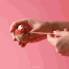 a bowl of sprinkles next to a measuring cup of chocolate