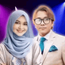 a man and a woman are posing for a picture together .