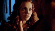 a man and a woman are looking at each other .