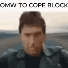 a close up of a man 's face with the words `` omw to cope block '' written below him .
