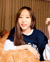 a woman with a tattoo on her arm that says byulbeast