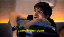 a man on a plane says " we 're broken down " in yellow letters