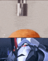 a close up of a robot 's face with a blurred background and the letter m in the corner