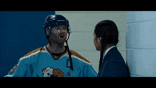 a hockey player wearing a jersey with the number 2 on it