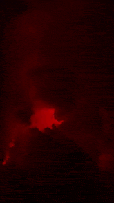 a painting of a red lightning bolt with a skull in the background