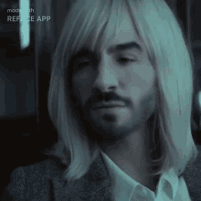 a man with long blonde hair and a beard is being made with reface app