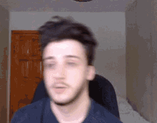 a blurry picture of a man 's face in a room