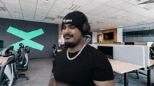a man wearing headphones and a beanie that says " jeffyard "