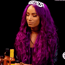 a woman with purple hair is wearing sunglasses and a choker .