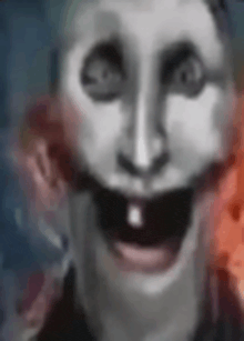 a close up of a person 's face with a mask on and a mouth open .