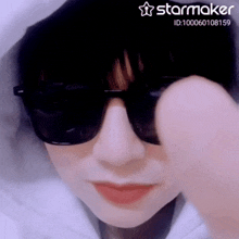 a close up of a person 's face with a starmaker watermark