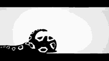 a black and white drawing of a tiger laying down on a white surface .