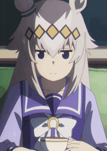 a girl in a purple and white outfit is holding a cup