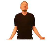 a man with his arms outstretched is wearing a black v-neck shirt