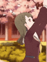 a girl in a school uniform is reaching up towards the sky