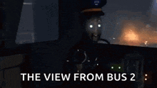 a man is sitting in the driver 's seat of a bus looking out the window .