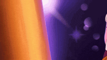 a close up of a person standing in front of a purple curtain .