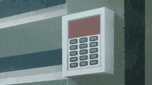 a white box with a calculator on it is hanging on a wall