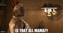 a woman is standing in a room with the words `` is that all mama '' written above her .