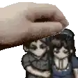 a hand is petting a couple of anime characters .