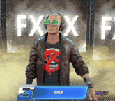 a man wearing headphones stands in front of a sign that says fxx