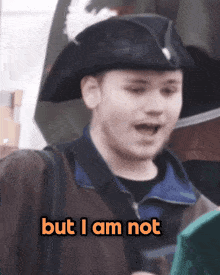 a man wearing a pirate hat and a jacket says but i am not