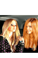 two women with red hair are posing for a picture