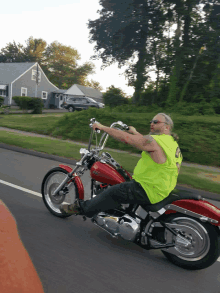 a man riding a harley davidson motorcycle on a road