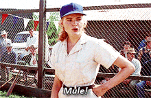 a woman in a baseball uniform says " mule "