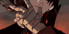 a close up of a person 's hand with a glove on