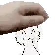 a hand is holding a drawing of a person 's face over their head .