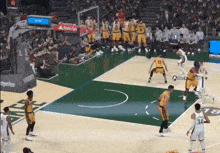 a basketball game is being played with a state farm ad in the background