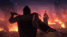 a man in a hood is standing in front of a burning building