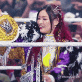a woman in a boxing ring with the words tiffany luv24 written on the bottom