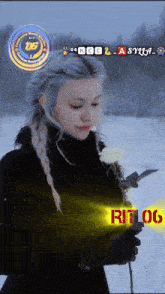 a woman in a black coat holds a white rose in front of a sign that says " rit 06 "