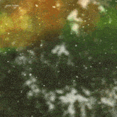 a blurred image of snow falling with the name vusal zaman in the upper right corner