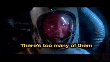 a man wearing a helmet and goggles says `` there 's too many of them '' in a movie scene .