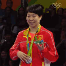 Showing Her Medal Li Xiaoxia GIF - Showing Her Medal Li Xiaoxia Olympics GIFs